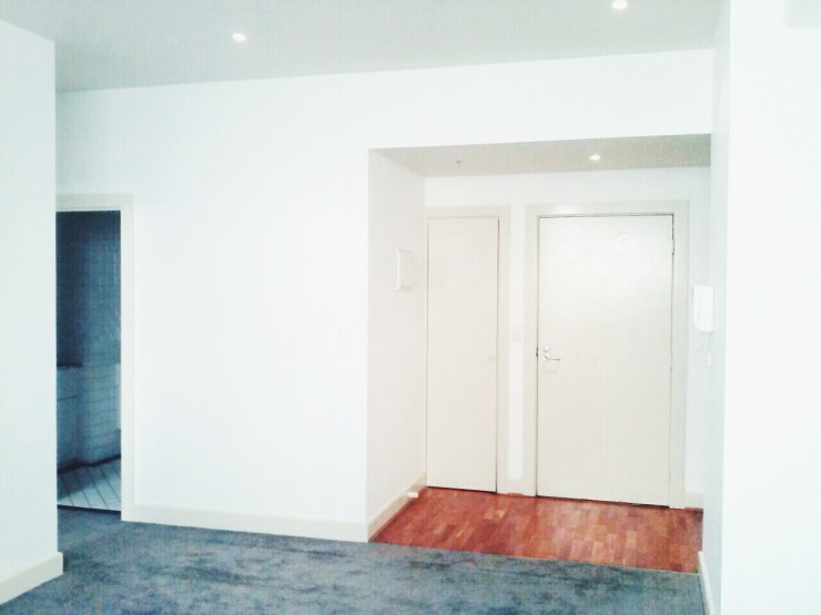 Henty House Unit 107 501 Little Collins Street Melbourne Entrance and living room view